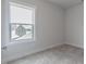 Bedroom with a large window overlooking a residential neighborhood at 2117 Treelight Way, Wendell, NC 27591