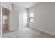 Bedroom with white trim, carpet, and a door into the hallway at 2117 Treelight Way, Wendell, NC 27591