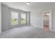 Bright bedroom with plush carpeting and large windows offering plenty of natural light at 2117 Treelight Way, Wendell, NC 27591