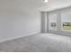 Comfortable carpeted bedroom with two windows providing natural light at 2117 Treelight Way, Wendell, NC 27591