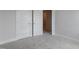 Neutral bedroom with a double door closet at 2117 Treelight Way, Wendell, NC 27591