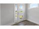 Bright entryway with decorative door and sidelights, showcasing modern finishes and hardwood flooring at 2117 Treelight Way, Wendell, NC 27591