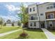 New construction townhouse with lawn and young landscaping; inviting facade with black-framed windows at 2117 Treelight Way, Wendell, NC 27591