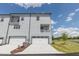 A lovely townhouse featuring an attached garage and a charming second-story balcony at 2117 Treelight Way, Wendell, NC 27591