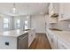 Open kitchen featuring a center island with quartz countertop and stainless steel appliances at 2117 Treelight Way, Wendell, NC 27591