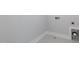 A basic laundry hookup area featuring tile floors and white trim at 2117 Treelight Way, Wendell, NC 27591