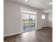 Living room featuring a sliding glass door leading to outdoor space with a field view at 2117 Treelight Way, Wendell, NC 27591