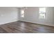 Living room with stylish lighting and beautiful windows, offering ample natural light at 2117 Treelight Way, Wendell, NC 27591