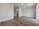 Spacious living room with sleek flooring, and access to a bathroom at 2117 Treelight Way, Wendell, NC 27591