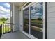 Outdoor patio with sliding glass doors offering views of lush scenery at 2117 Treelight Way, Wendell, NC 27591