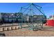 Playground equipment with climbing ropes and steps in front of a neighborhood at 2117 Treelight Way, Wendell, NC 27591