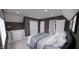 Bright bedroom with double doors and dresser at 2417 Bivins Rd, Durham, NC 27712