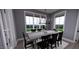 Elegant dining room with a rustic table and scenic views at 2417 Bivins Rd, Durham, NC 27712