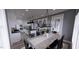 Open dining room adjacent to a well-equipped kitchen at 2417 Bivins Rd, Durham, NC 27712