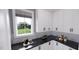 White kitchen with corner pantry and dark countertops at 2417 Bivins Rd, Durham, NC 27712