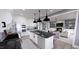 Open concept kitchen and living room with modern finishes at 2417 Bivins Rd, Durham, NC 27712
