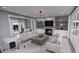 Open living room showcasing a cozy fireplace and ample seating at 2417 Bivins Rd, Durham, NC 27712