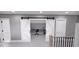 Home office with barn doors and built-in shelves at 2417 Bivins Rd, Durham, NC 27712