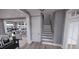 Staircase with view into kitchen and living room at 2417 Bivins Rd, Durham, NC 27712
