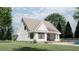 Rear view of house with pool and patio, side yard view at 2423 Bivins Rd, Durham, NC 27712