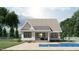 Rear view of house showcasing the pool and patio at 2423 Bivins Rd, Durham, NC 27712