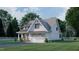 Two-story white house with gray roof and attached garage, side yard view at 2423 Bivins Rd, Durham, NC 27712
