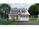 Two-story white house with gray roof, attached garage, and front porch at 2423 Bivins Rd, Durham, NC 27712