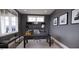 Bright home office features built-in shelves and large windows with mountain views at 2423 Bivins Rd, Durham, NC 27712
