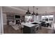 Open concept kitchen with island, stainless steel appliances, and mountain views at 2423 Bivins Rd, Durham, NC 27712