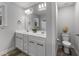 Double vanity bathroom with modern fixtures and grey tile floor at 263 Langdon Chase Way, Selma, NC 27576