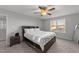 Cozy bedroom with king-size bed and large window at 263 Langdon Chase Way, Selma, NC 27576