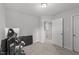 Well-lit bedroom with access to a hallway and additional space at 263 Langdon Chase Way, Selma, NC 27576