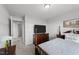 Bright bedroom with a dresser and a TV, showcasing the home's interior at 263 Langdon Chase Way, Selma, NC 27576
