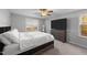 Bright bedroom with king bed and large TV at 263 Langdon Chase Way, Selma, NC 27576