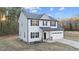 Two-story house with attached garage and landscaping at 263 Langdon Chase Way, Selma, NC 27576