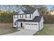 Two-story house with attached garage and landscaping at 263 Langdon Chase Way, Selma, NC 27576