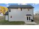 Rear view of house, showcasing the backyard and patio at 263 Langdon Chase Way, Selma, NC 27576