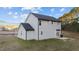 Two-story house with gray siding, black roof, and a patio at 263 Langdon Chase Way, Selma, NC 27576