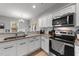 Modern kitchen with stainless steel appliances and granite countertops at 263 Langdon Chase Way, Selma, NC 27576