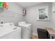 Convenient laundry room with washer, dryer, and shelving at 263 Langdon Chase Way, Selma, NC 27576