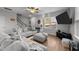 Living room with gray sofas, large TV, and hardwood floors at 263 Langdon Chase Way, Selma, NC 27576
