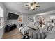 Living room with gray sofas, large TV, and hardwood floors at 263 Langdon Chase Way, Selma, NC 27576