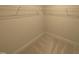 White wire shelving provides ample storage space in this carpeted walk-in closet at 46 Steppe Way, Garner, NC 27529