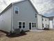 Gray and white two-story townhome with a private patio at 4937 S Trout Crest, Raleigh, NC 27604