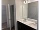 Double vanity bathroom with a large mirror and linen closet at 4937 S Trout Crest, Raleigh, NC 27604