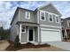 Two-story home with gray siding, white trim, and a two-car garage at 4937 S Trout Crest, Raleigh, NC 27604