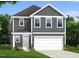 Two-story home with gray siding, white trim, and a two-car garage at 4937 S Trout Crest, Raleigh, NC 27604