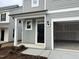 Two-story home featuring a black front door and covered porch at 4937 S Trout Crest, Raleigh, NC 27604
