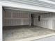 Empty two-car garage with concrete floor and open overhead door at 4937 S Trout Crest, Raleigh, NC 27604