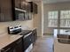 Modern kitchen with stainless steel appliances and an island at 4937 S Trout Crest, Raleigh, NC 27604